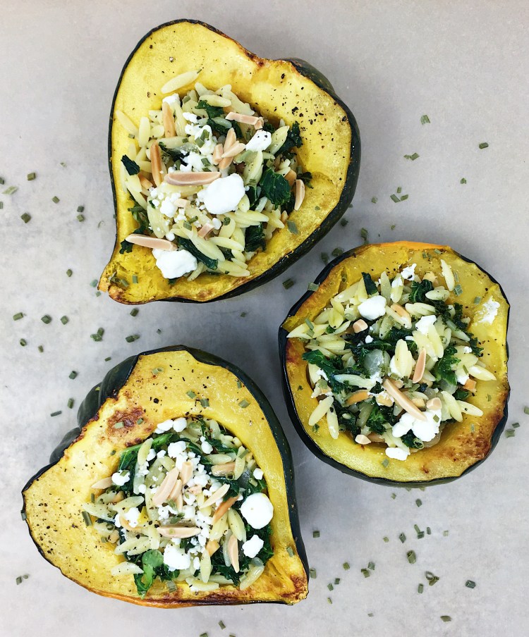 stuffed acorn squash with kale orzo almonds and goat cheese
